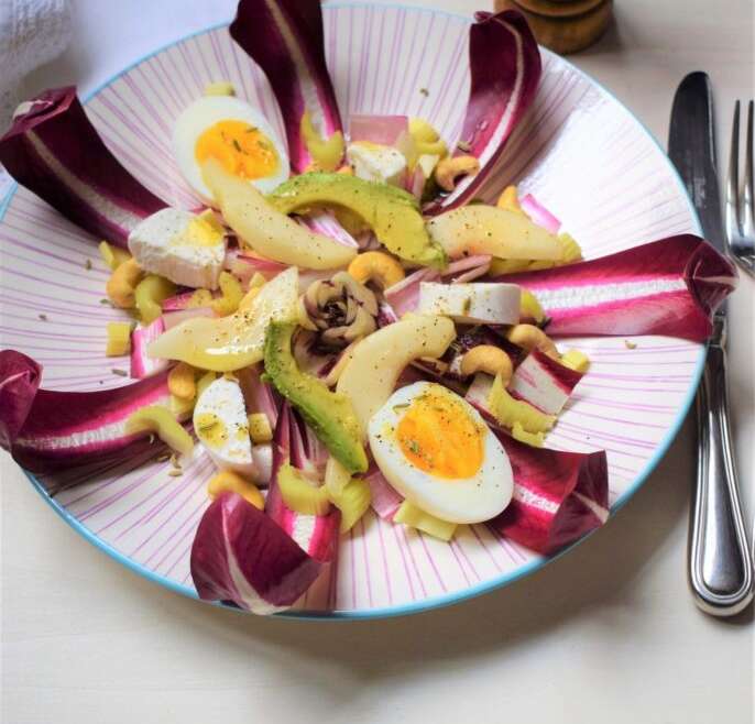 Easter salad with radicchio, pear, cashews and avocado