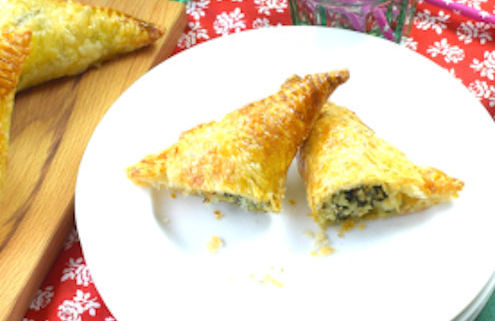 puff pastry triangles stuffed with fish and spinach