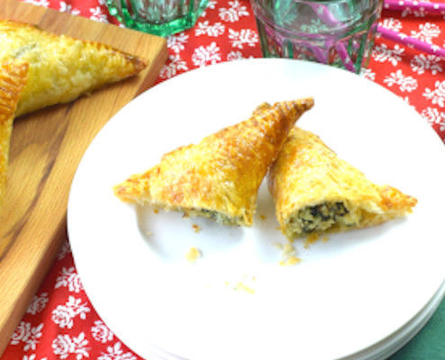 puff pastry triangles stuffed with fish and spinach