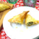 puff pastry triangles stuffed with fish and spinach