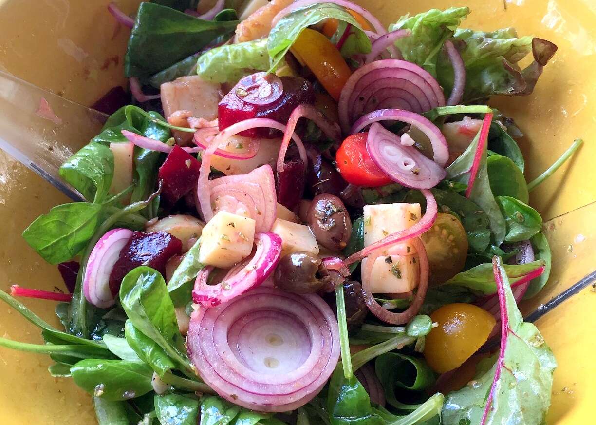 Big salad with potatoes, beets, provolone cheese & olives